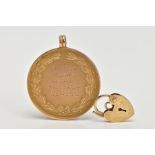 A 9CT GOLD MEDALLION AND YELLOW METAL CHARM, a yellow gold round medallion signed 'Duke of York's
