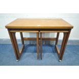 A MCINTOSH TRIFORM TEAK NESTING TABLES, with a fold over top, and two small tables, width 75cm x