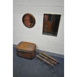 AN EARLY 20TH ALBANY COPPER CIRCULAR MIRROR, a tin trunk, a vintage sleigh, another mirror and two