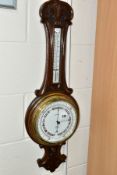 A LATE VICTORIAN WALNUT STAINED ANEROID BAROMETER, ceramic centigrade / Fahrenheit scale and dial,