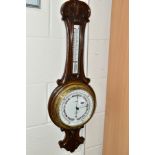 A LATE VICTORIAN WALNUT STAINED ANEROID BAROMETER, ceramic centigrade / Fahrenheit scale and dial,