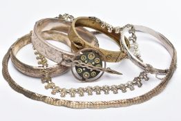 A VICTORIAN SILVER BANGLE AND OTHER SILVER AND WHITE METAL JEWELLERY, a hinged silver buckle bangle,