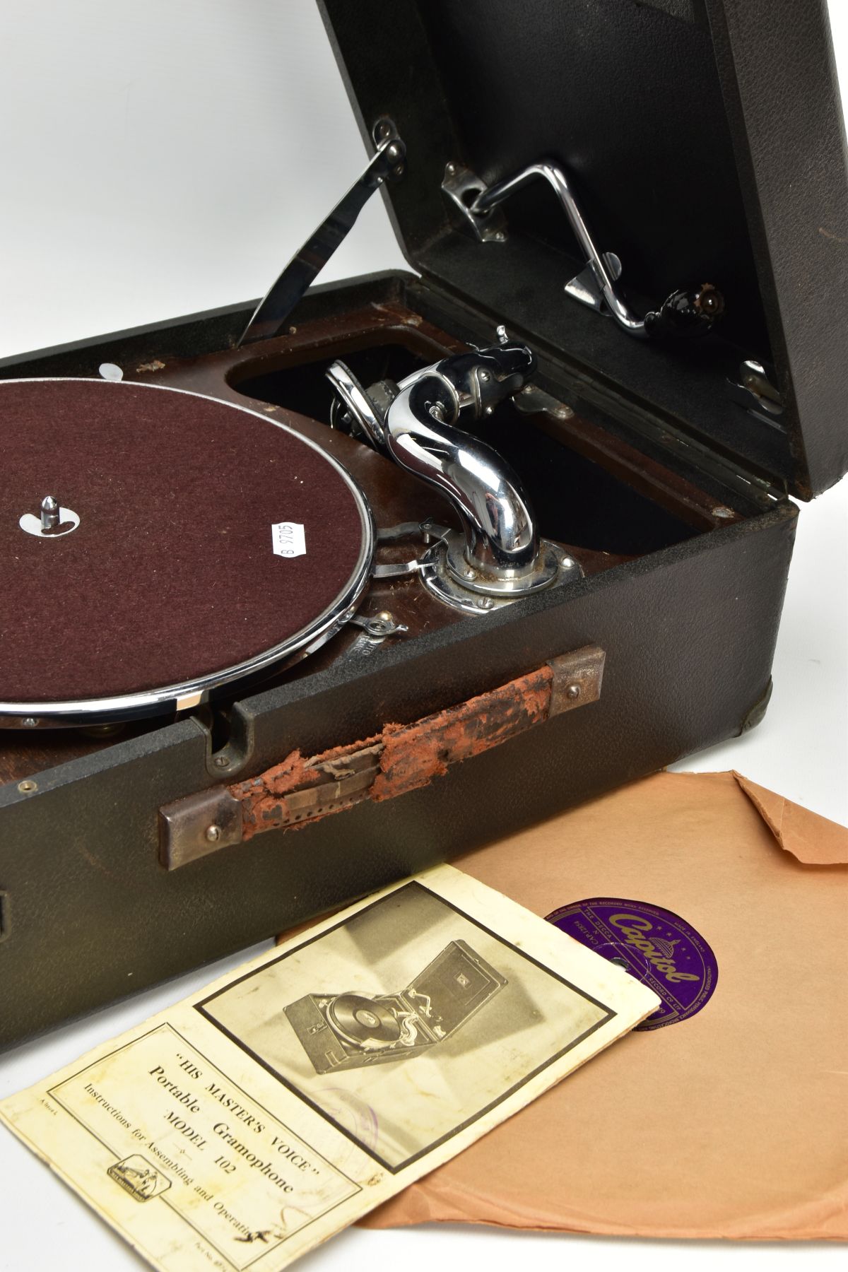 A HMV BLACK CASED PORTABLE GRAMOPHONE MODEL 102, with printed instructions and a Nat King Cole - Image 6 of 7