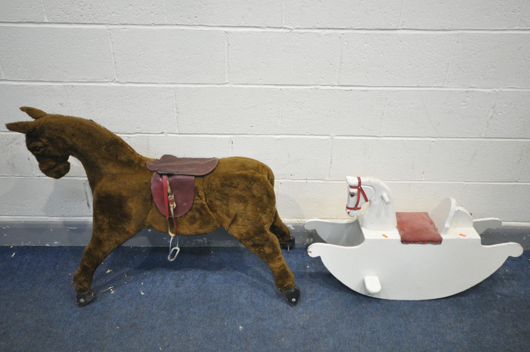 A PAINTED BOW ROCKING HORSE, and an upholstered rocking horse (missing base base) (2)