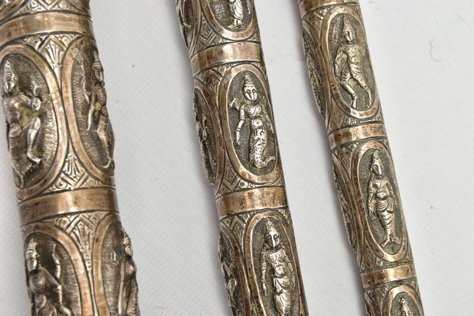 AN ASIAN WHITE METAL WALKING CANE, embossed religious figures throughout, can be taken apart into - Image 2 of 7