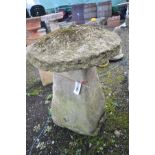 AN EARLY SANDSTONE STADDLE STONE WITH TOP, base in rectangular tapered form, bottom of base 44cm x