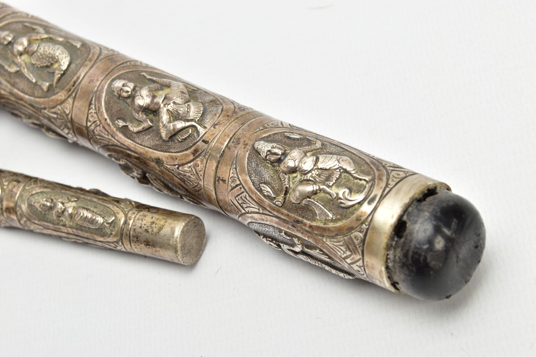 AN ASIAN WHITE METAL WALKING CANE, embossed religious figures throughout, can be taken apart into - Image 7 of 7