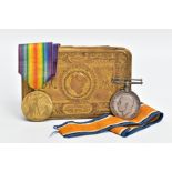 A 1914 PRINCESS MARY TIN, containing a British War & Victory pair of medals, named 3528 Sjt J.S.