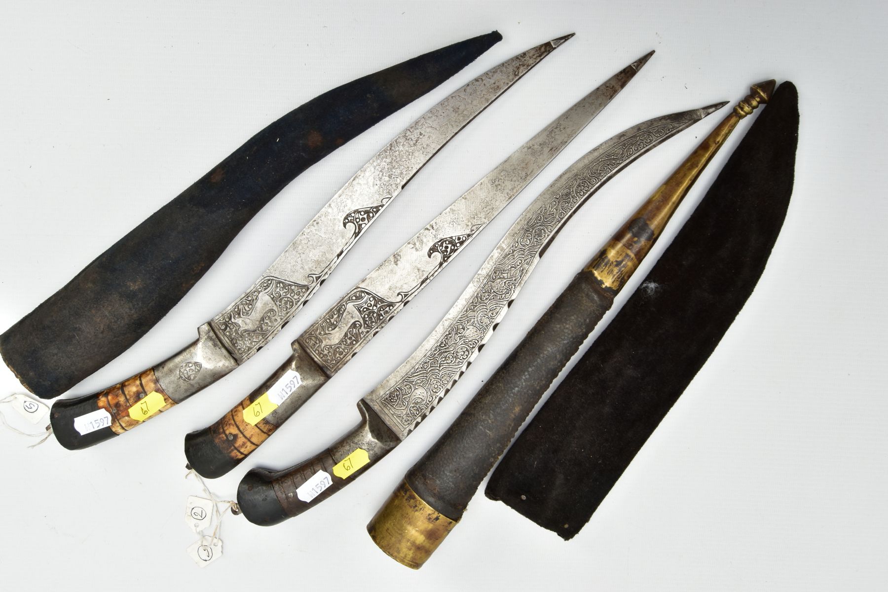 THREE INDIAN/ASIAN short daggers all with skin covered wooden scabbards, one with straight blade - Image 6 of 9