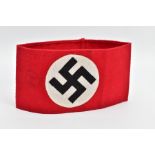 A THIRD REICH PERIOD SA(NSDAP) WOOLEN ARMBAND, complete and still retains the paper label from the