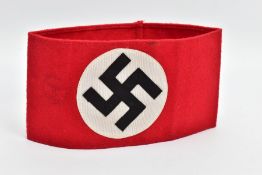 A THIRD REICH PERIOD SA(NSDAP) WOOLEN ARMBAND, complete and still retains the paper label from the