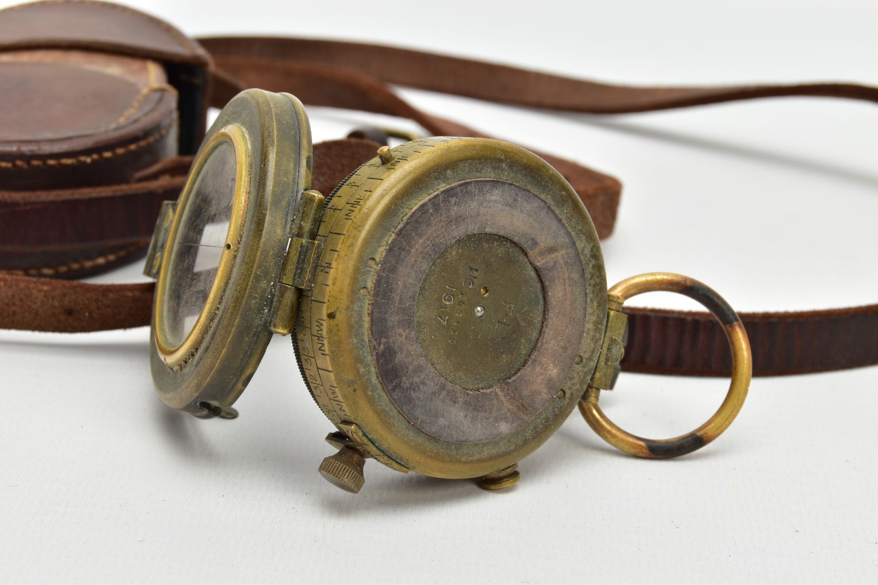 A WORLD WAR ONE ERA FIELD COMPASS, WAR OFFICE, DATED 1917, in its correct brown leather carrying - Image 3 of 6