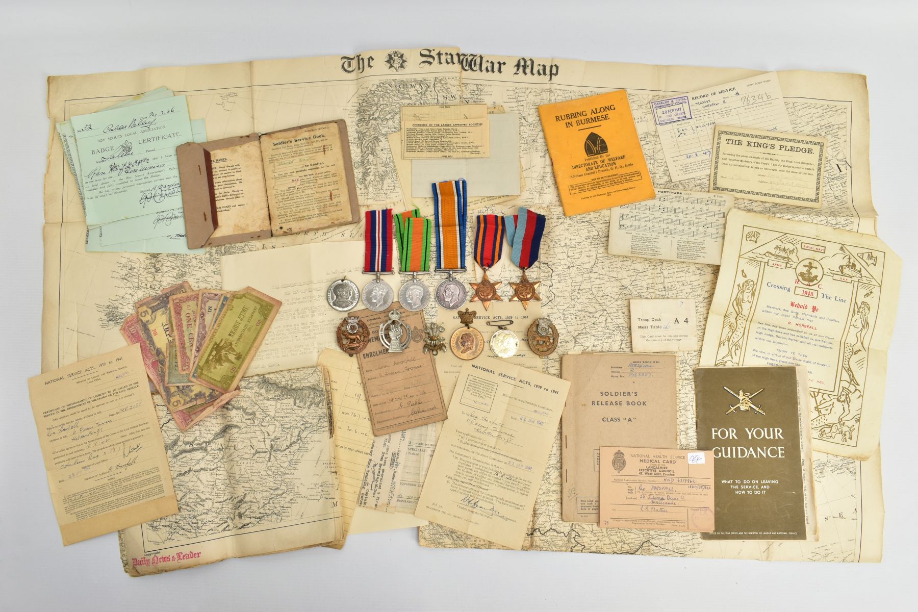 A BOX CONTAINING WORLD WAR TWO MEDALS, CAP BADGES AND EPHEMERA, to include, 1939-45, Burma Stars,