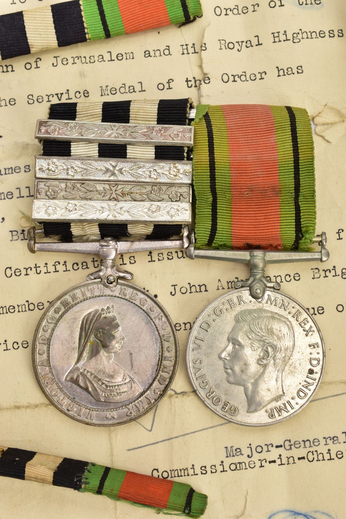 A BAR MOUNTED GROUP OF TWO MEDALS, to include Victoria Crowned Bust (1st obverse) Order of St John & - Image 2 of 5