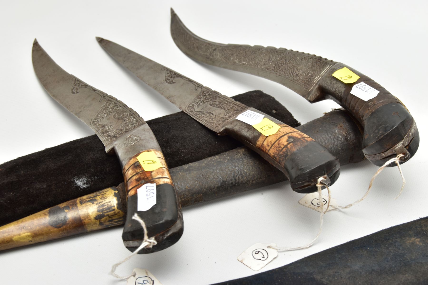 THREE INDIAN/ASIAN short daggers all with skin covered wooden scabbards, one with straight blade - Image 8 of 9