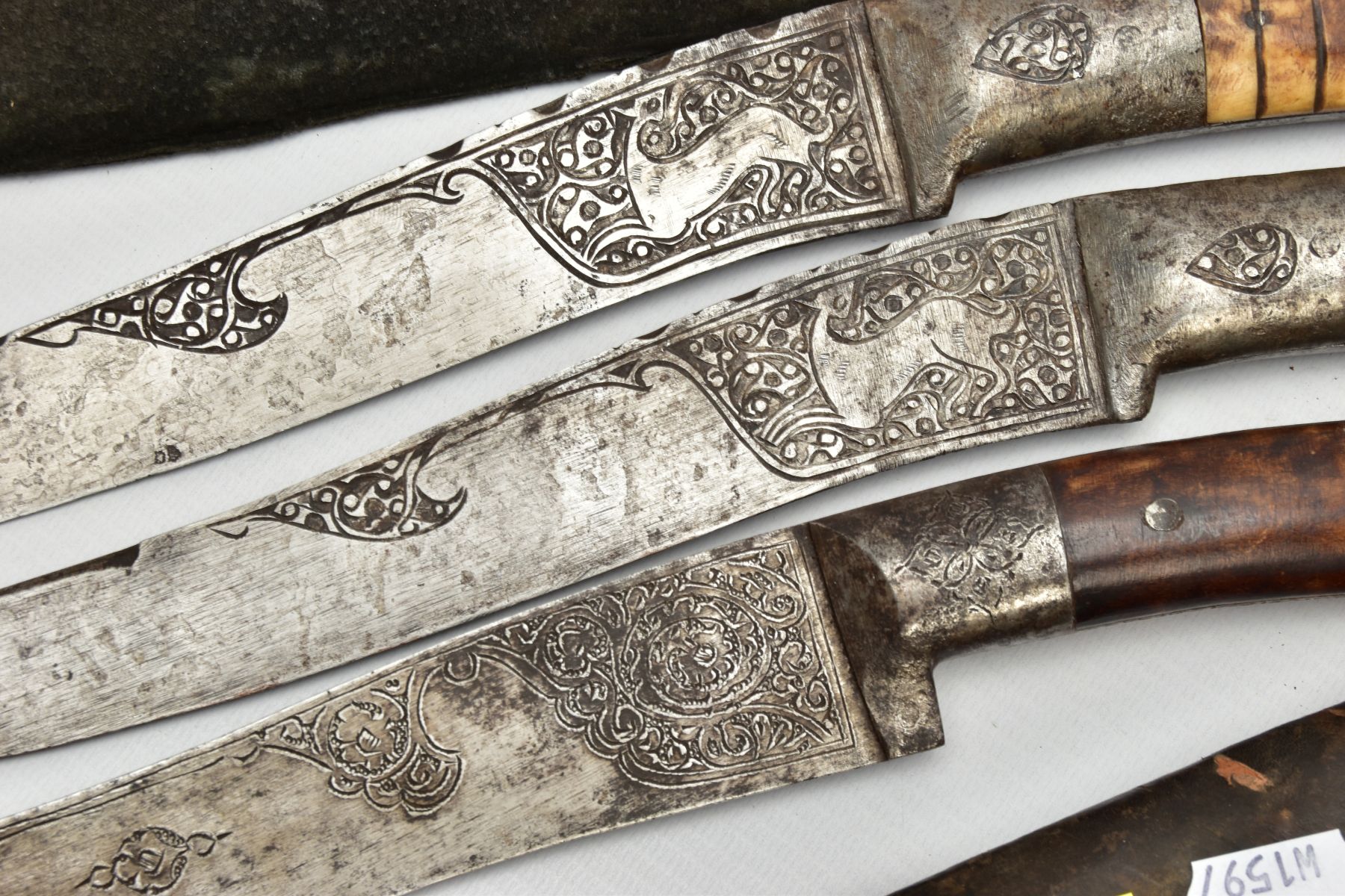 THREE INDIAN/ASIAN short daggers all with skin covered wooden scabbards, all curved and etched - Image 8 of 9