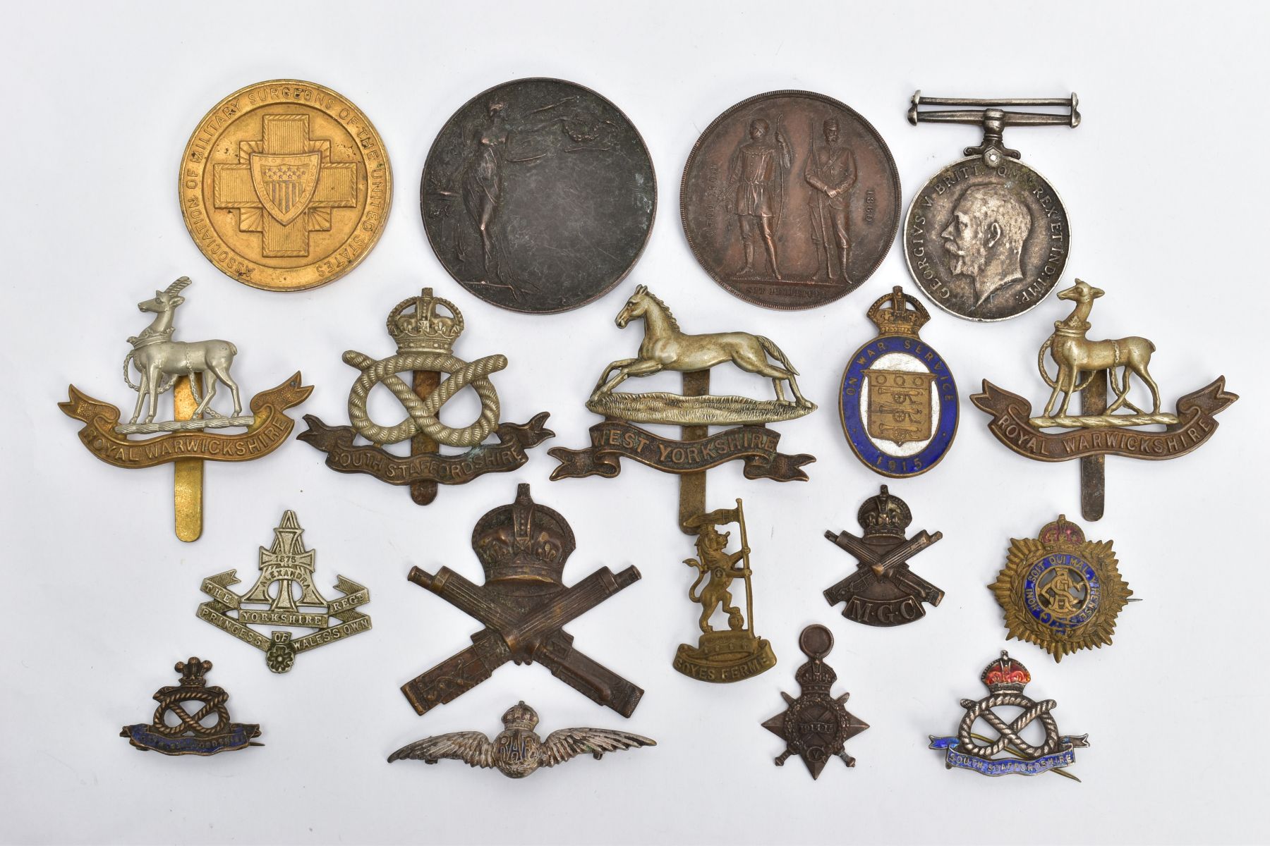 A BOX OF WORLD WAR ONE PERIOD CAP BADGES ETC, to include South Staffordshire, West Yorkshire,