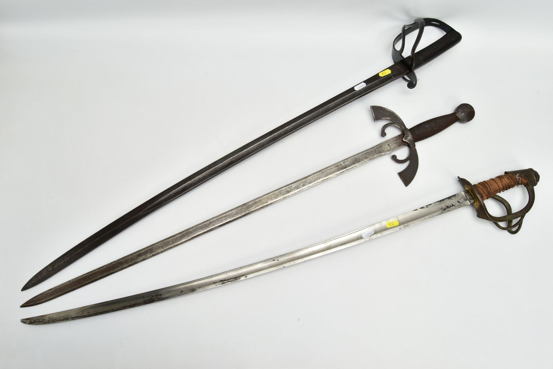 THREE MILITARY SWORDS, a Medieval style sword with ornate cross guard, blade marked Toledo, a French