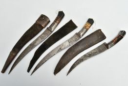 THREE INDIAN/ASIAN short daggers all with skin covered wooden scabbards, all curved and etched