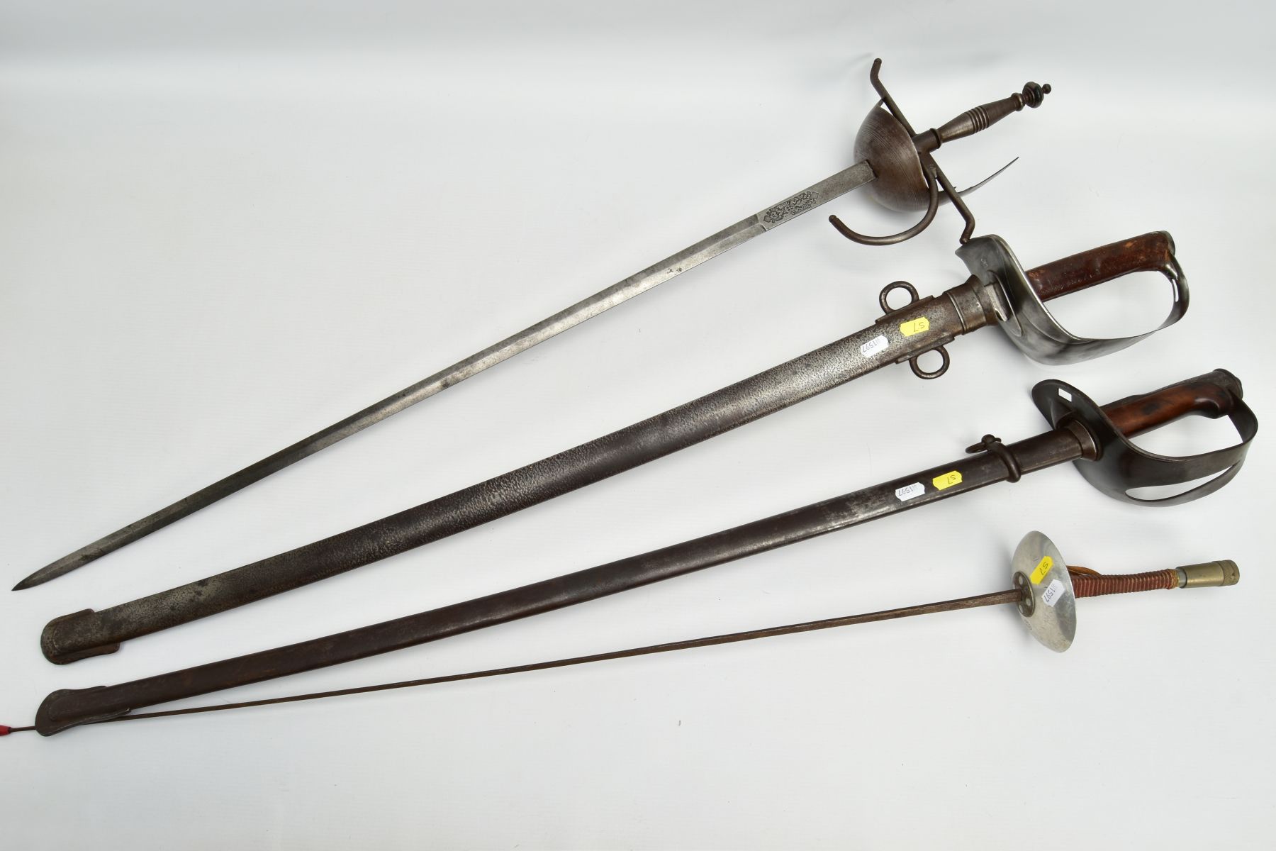 FOUR BLADED WEAPONS to include a Spanish Medieval style sword with Carlos III markings and Toledo to