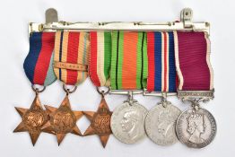 A GROUP OF SIX WORLD WAR TWO MEDALS, on a wearing Bar, to include 1939-45, Africa (1st Army Bar)