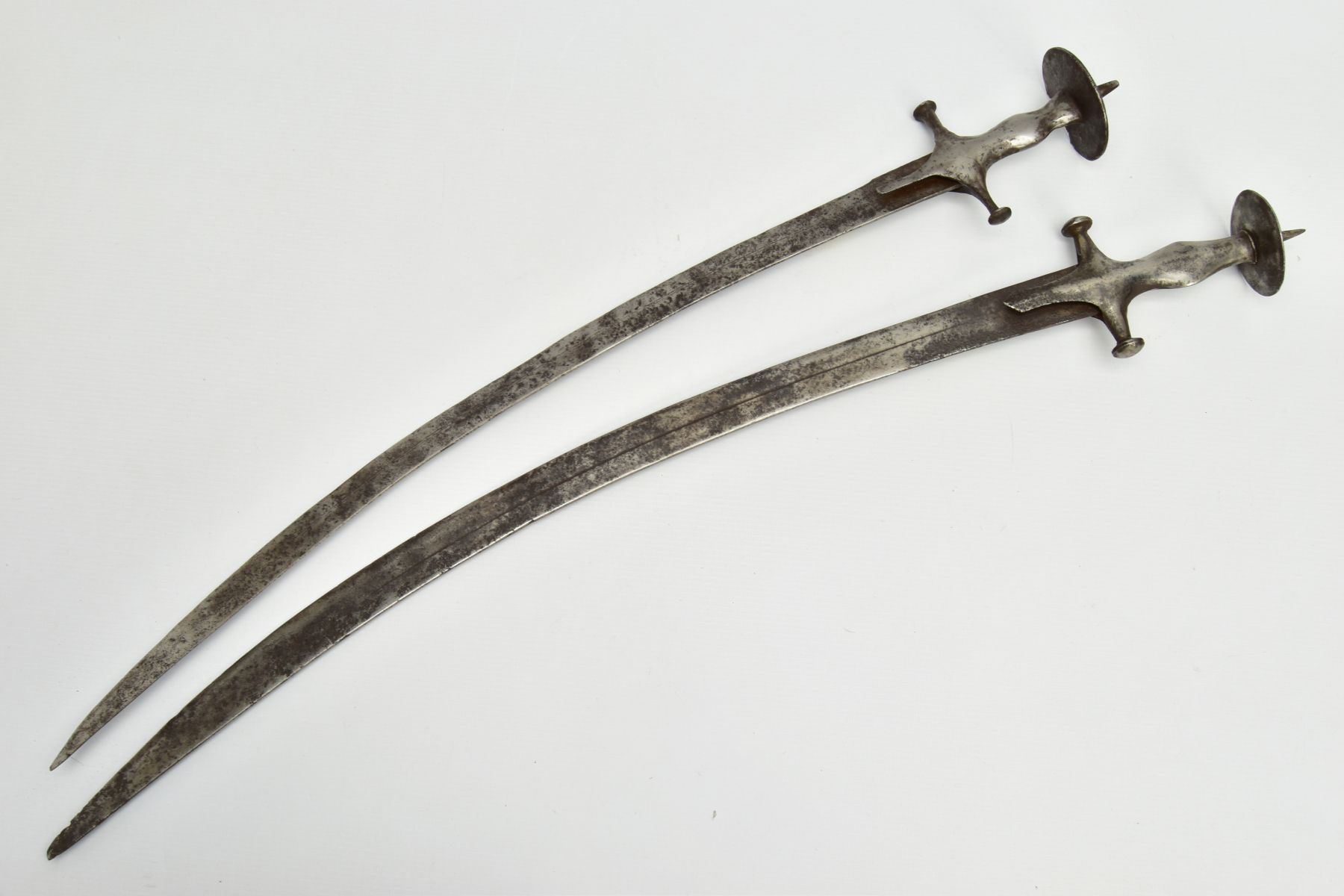A PAIR OF TALWAR SWORDS, blade length approximately 70cm & 67cm, single fullered, no other