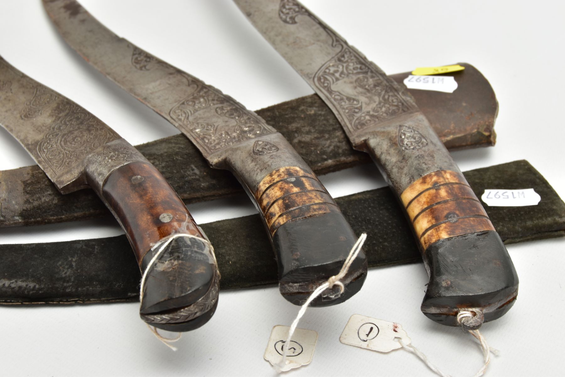THREE INDIAN/ASIAN short daggers all with skin covered wooden scabbards, all curved and etched - Image 9 of 9