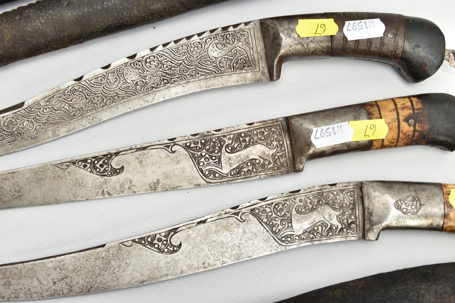 THREE INDIAN/ASIAN short daggers all with skin covered wooden scabbards, one with straight blade - Image 7 of 9