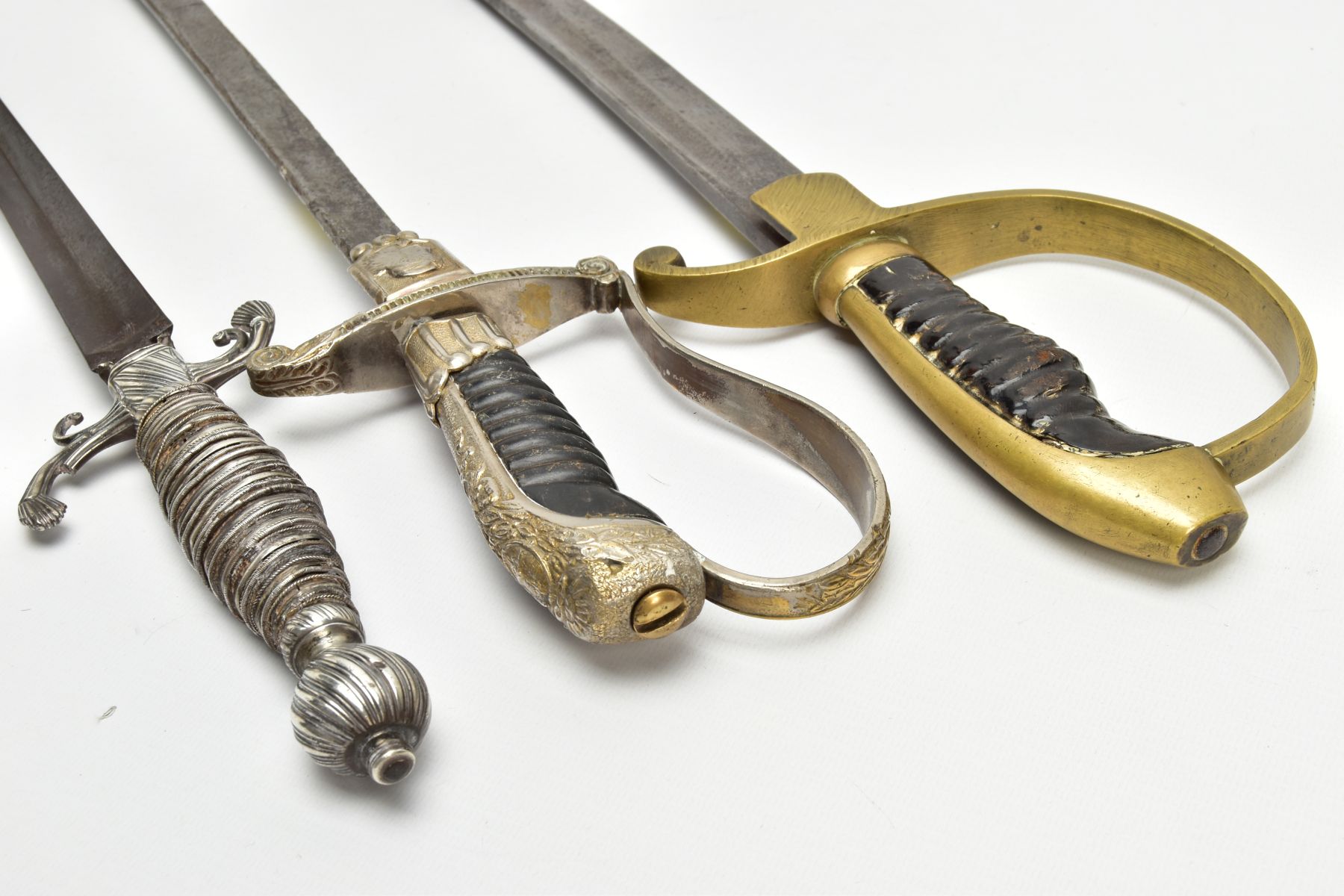 THREE SWORDS BELIEVED 19TH Century, a white metal ornate grip and cross guard blade tip broken, - Image 6 of 12