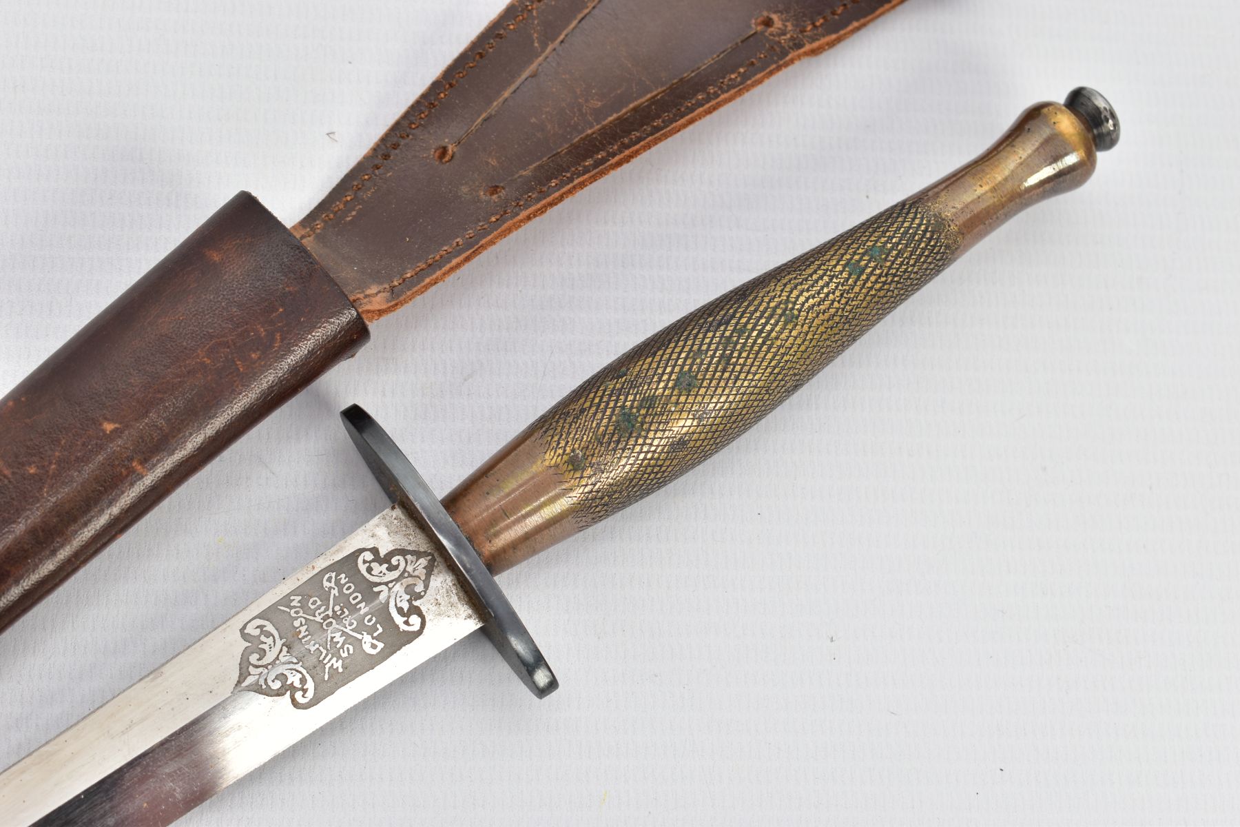 A FAIRBAIRN-SYKES FIGHTING KNIFE, complete with leather scabbard, this example is believed to be a - Image 2 of 7