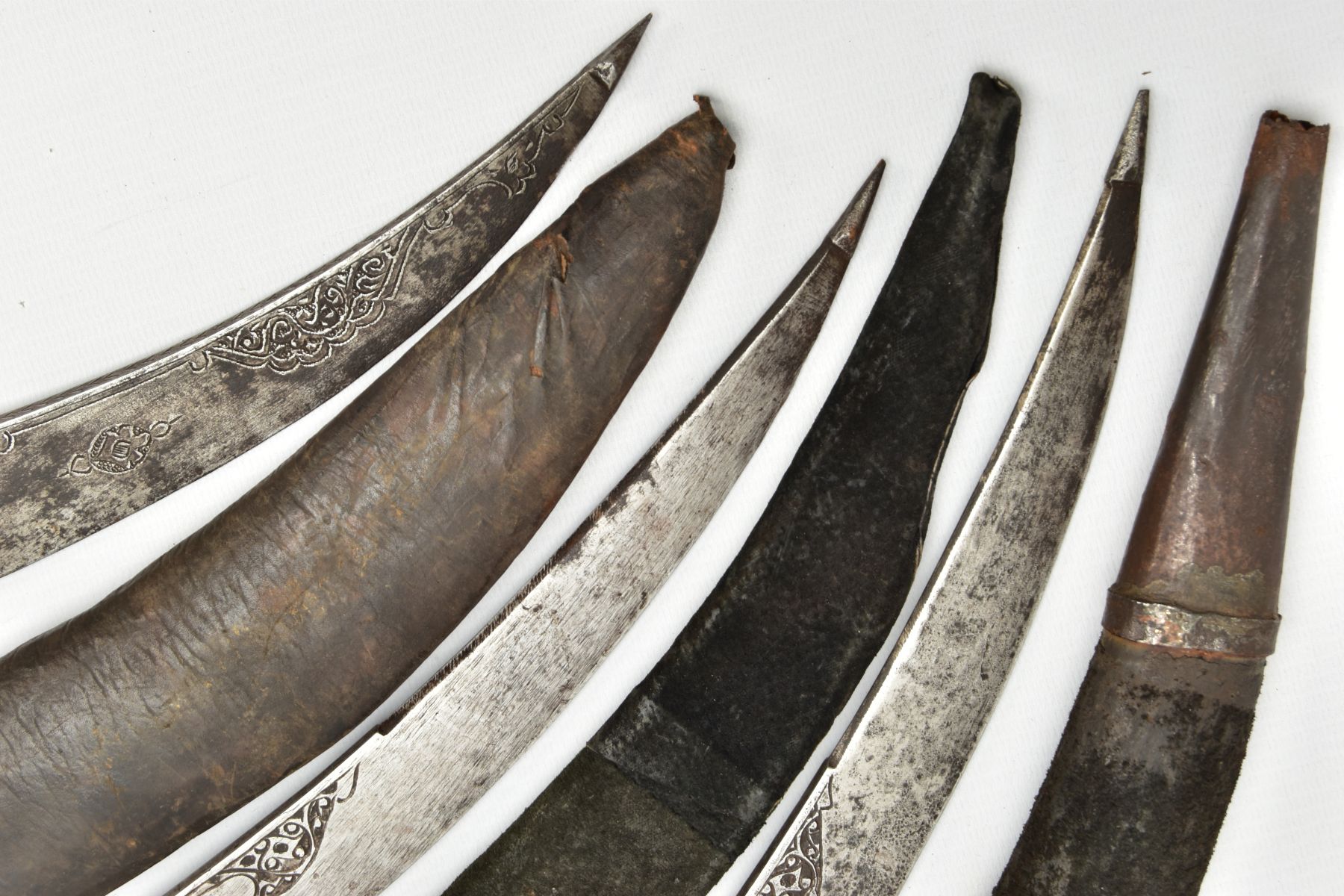 THREE INDIAN/ASIAN short daggers all with skin covered wooden scabbards, all curved and etched - Image 5 of 9