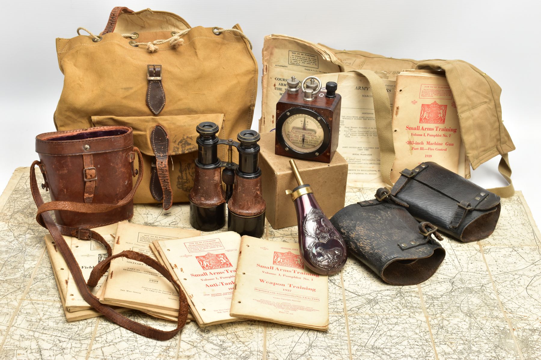 A BOX CONTAINING WWII/POST WWII field equipment, namely a shoulder bag with lots of military