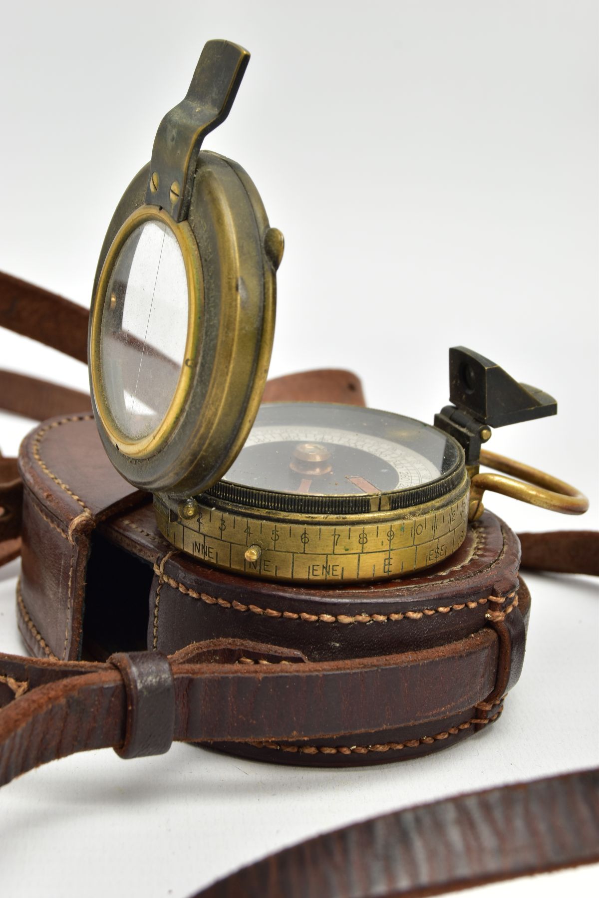 A WORLD WAR ONE ERA FIELD COMPASS, WAR OFFICE, DATED 1917, in its correct brown leather carrying - Image 6 of 6