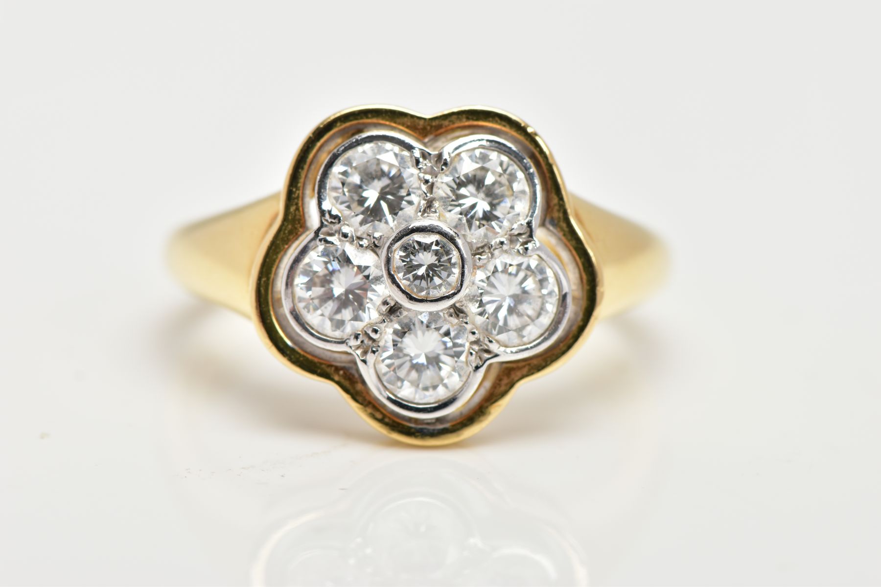 A MODERN DIAMOND CLUSTER RING, seven round brilliant cut diamonds, rim and grain set in a floral - Image 6 of 7