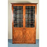 A GEORGE IV MAHOGANY ASTRAGAL GLAZED TWO DOOR BOOKCASE, the square panelled glazing enclosing two