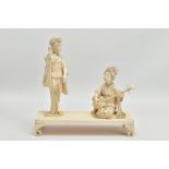A JAPANESE MEIJI PERIOD CARVED IVORY GROUP ON A RECTANGULAR IVORY STAND, the figures comprising a