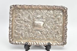 A LATE VICTORIAN SILVER DRESSING TABLE TRAY OF RECTANGULAR FORM, repousse decorated with a gadrooned