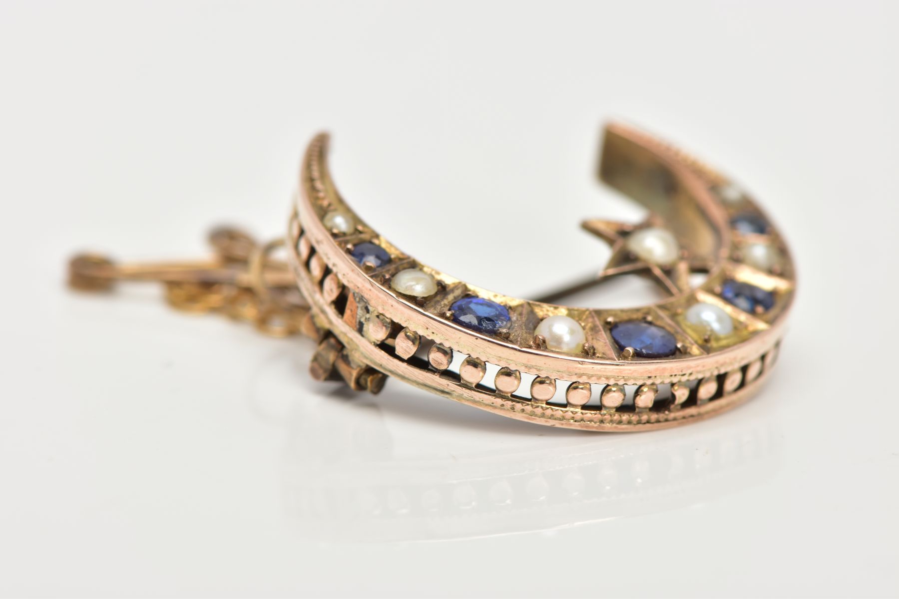 A LATE VICTORIAN 9CT GOLD SAPPHIRE AND SPLIT PEARL CRESCENT BROOCH, designed as circular sapphires - Image 4 of 7