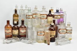 A COLLECTION OF THIRTY ONE GLASS PHARMACY BOTTLES, twenty four clear and seven brown, the brown