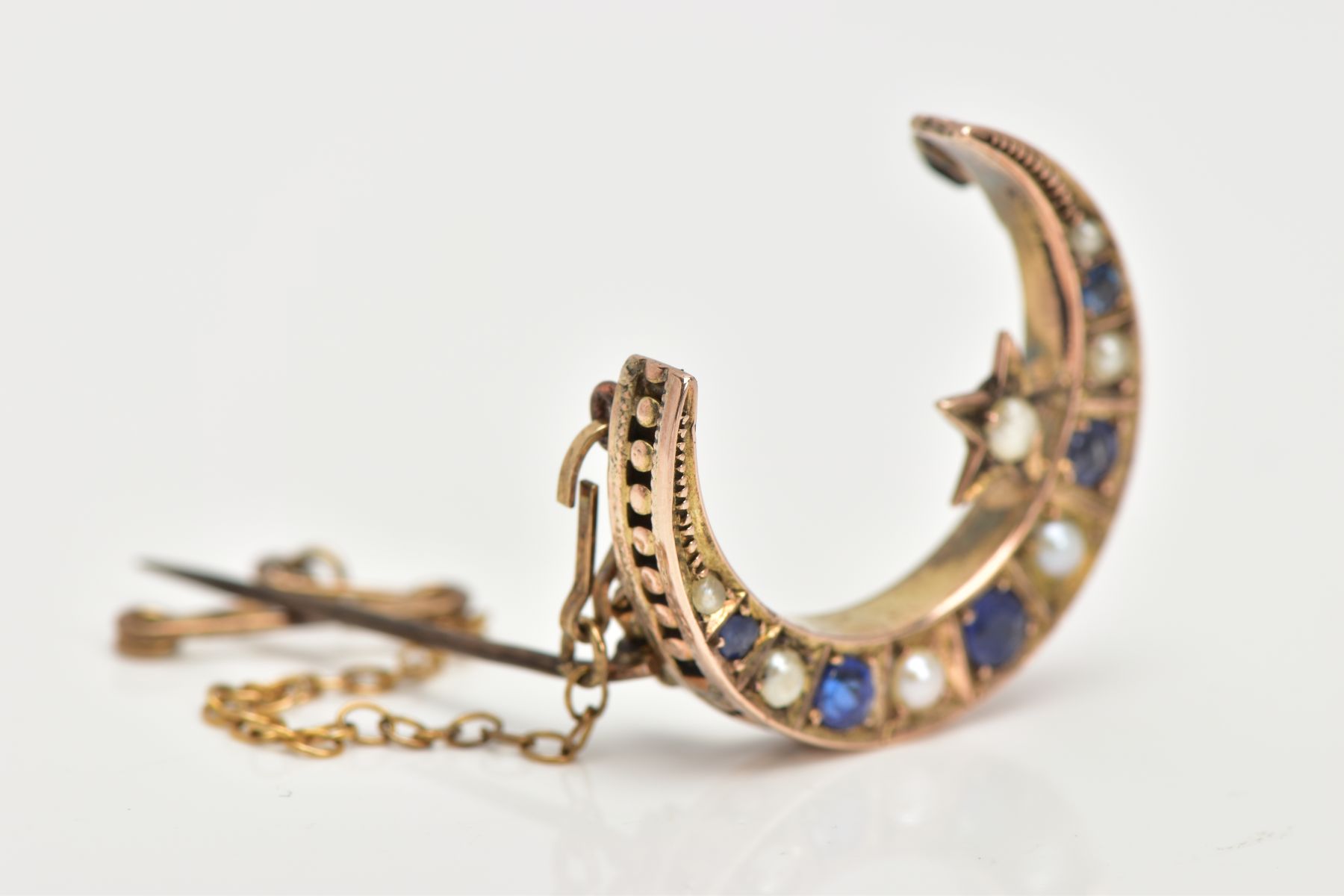 A LATE VICTORIAN 9CT GOLD SAPPHIRE AND SPLIT PEARL CRESCENT BROOCH, designed as circular sapphires - Image 2 of 7