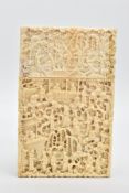 A LATE 19TH CENTURY CHINESE CANTON CARVED IVORY CARD CASE, depicting pagodas, trees and figures,