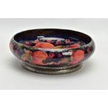 A WILLIAM MOORCROFT POMEGRANATE DESIGN TUDRIC PEWTER BASED FRUIT BOWL FOR LIBERTY & CO, the