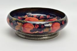 A WILLIAM MOORCROFT POMEGRANATE DESIGN TUDRIC PEWTER BASED FRUIT BOWL FOR LIBERTY & CO, the