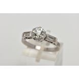 AN EARLY TO MID TWENTIETH CENTURY THREE STONE DIAMOND RING, centring on an early brilliant cut