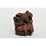 A JAPANESE MEIJI PERIOD CARVED WOOD OKIMONO, depicting a swirl of beasts including a dragon,