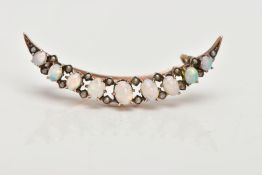 A LATE VICTORIAN 9CT GOLD OPAL AND SPLIT PEARL CRESCENT BROOCH, designed as a graduated row of