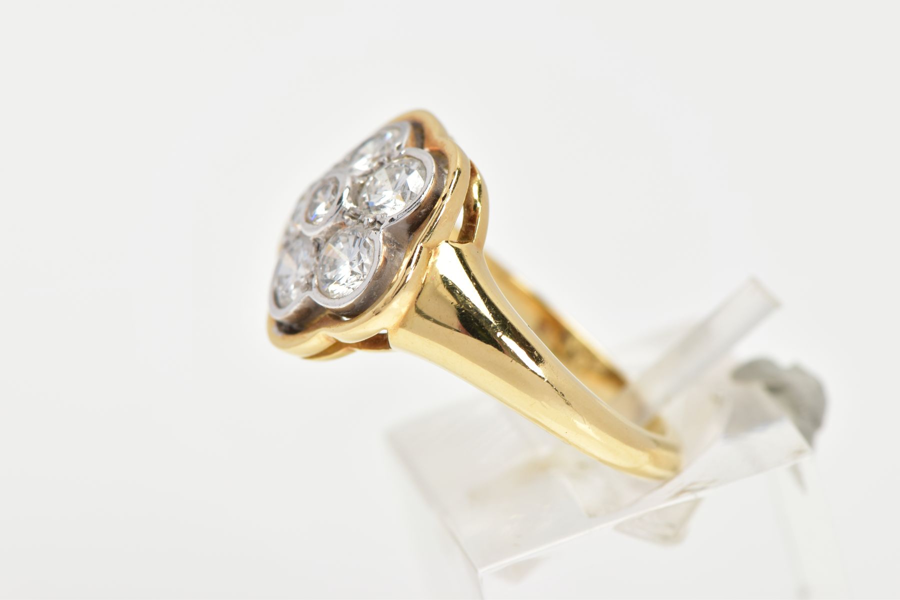 A MODERN DIAMOND CLUSTER RING, seven round brilliant cut diamonds, rim and grain set in a floral - Image 2 of 7