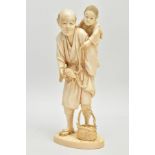 A JAPANESE MEIJI PERIOD IVORY OKIMONO, of a man holding a child on his back and a tortoise on a rope