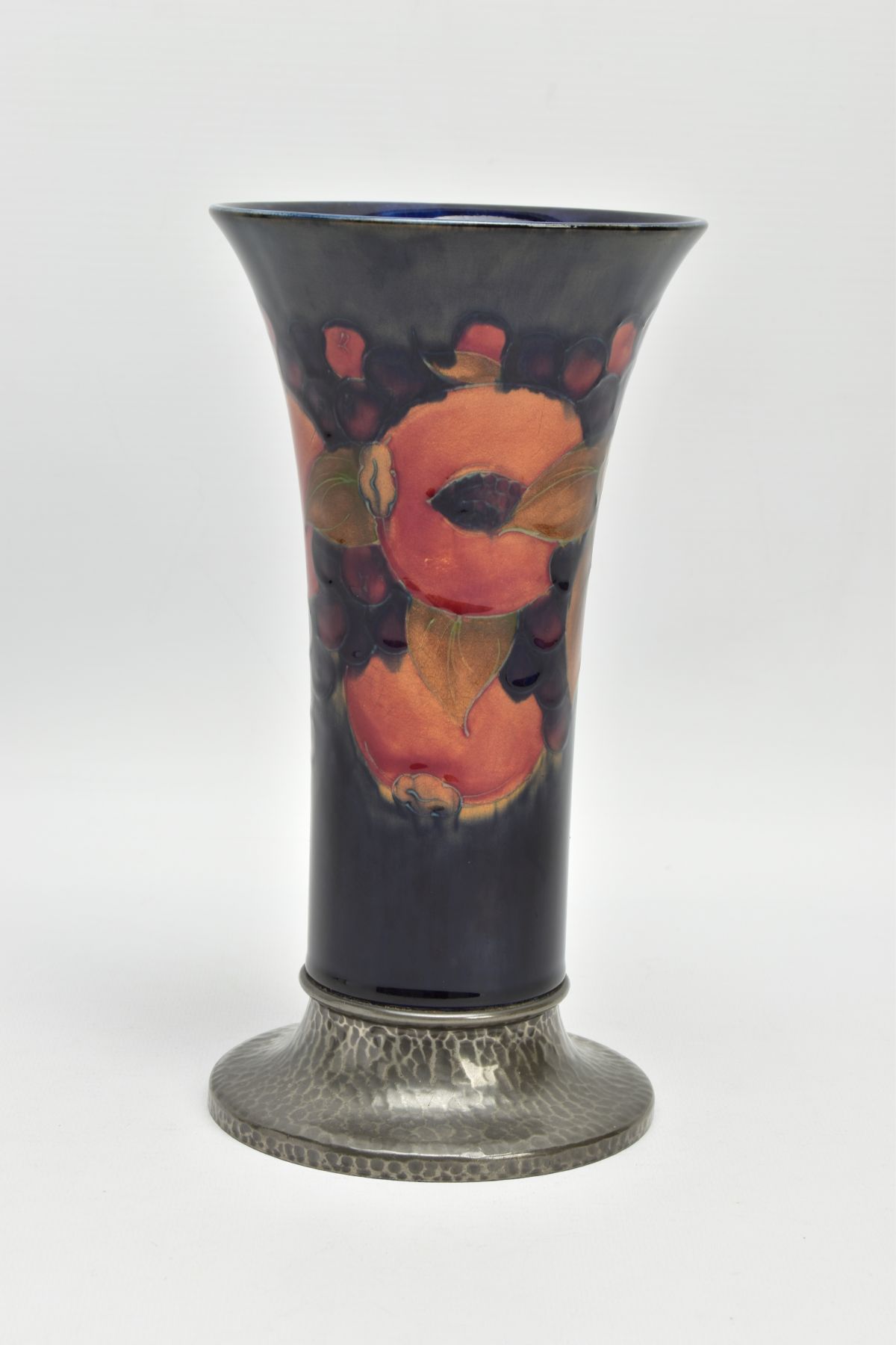 A WILLIAM MOORCROFT POMEGRANATE DESIGN TUDRIC PEWTER BASED VASE FOR LIBERTY & CO, the vase of