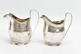 TWO GEORGE III SILVER HELMET SHAPED CREAM JUGS, both with bright cut decoration, strap handles,